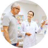A customer speaking with a pharmacist